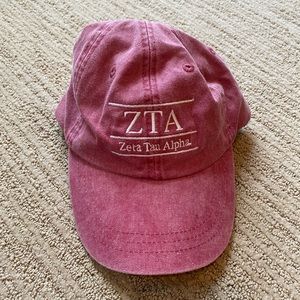 Faded red Zeta Tau Alpha (ZTA) adjustable hat
